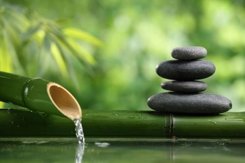 Spa still life with bamboo fountain and zen stone